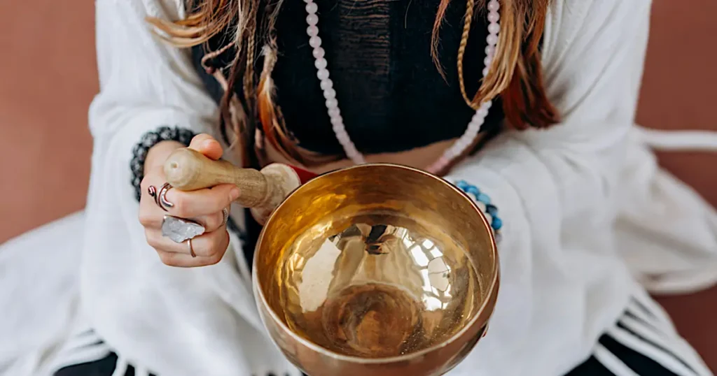 A serene sound therapy session with singing bowls, gongs, and chimes creating a calming environment for relaxation and healing.
